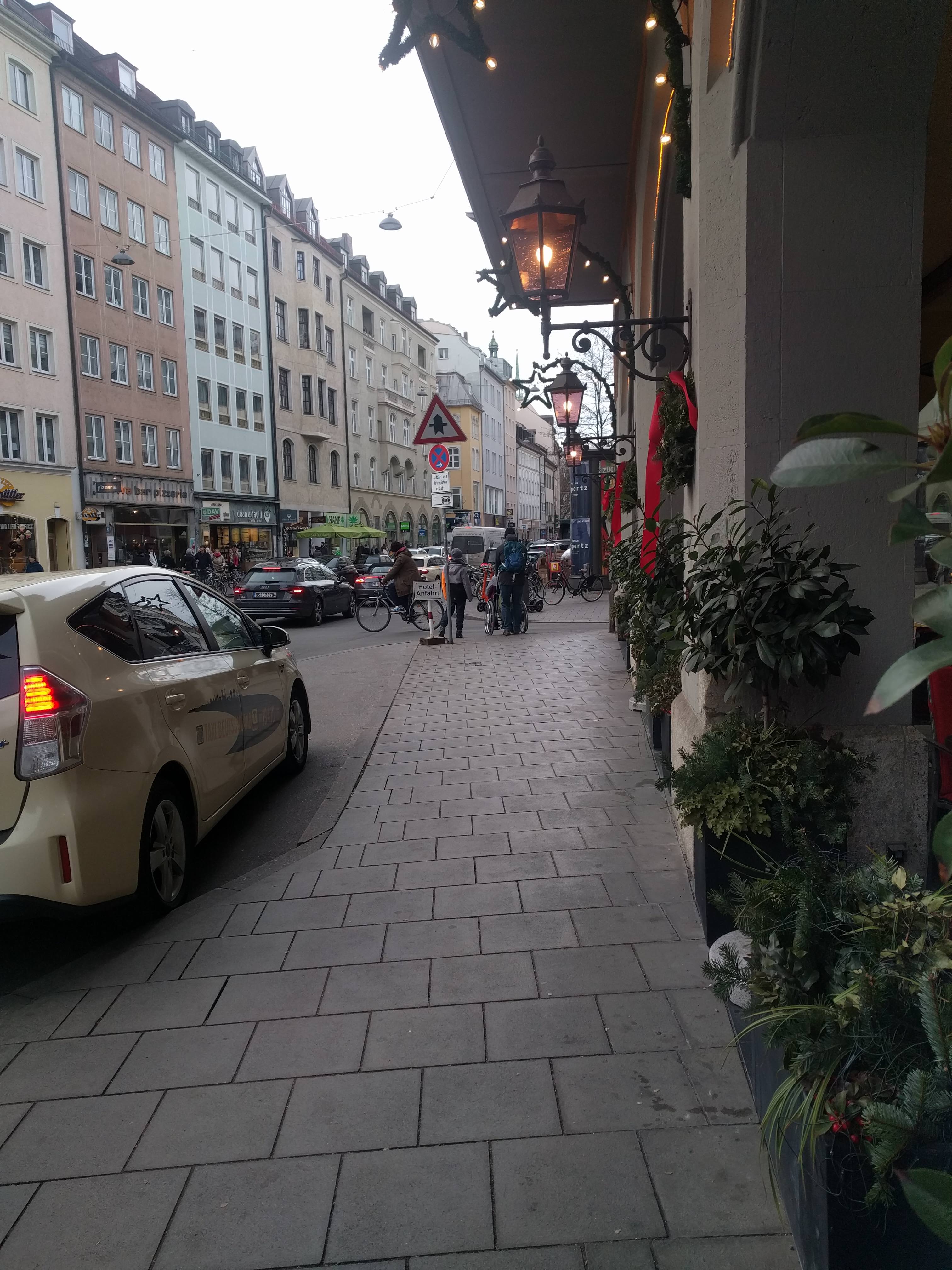 tal street with buildings and shops